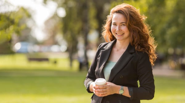 An AI-generated outdoor professional headshot of a woman posing sideways